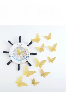 Detail of 3D gold hollow butterfly wall stickers with metallic texture for room decor