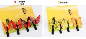 Close-up of red and yellow realistic butterfly hair clips with 4 pieces on display card