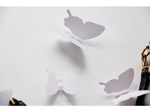 Detailed view of white 3D PVC butterflies with delicate wings for wall decoration