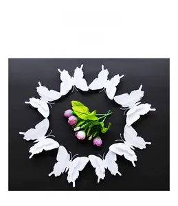 Detailed view of 3D double-layer white butterflies arranged around a central flower