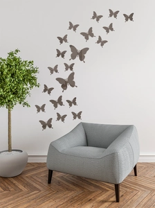 Coffee brown acrylic butterfly wall stickers displayed on a white living room wall decor