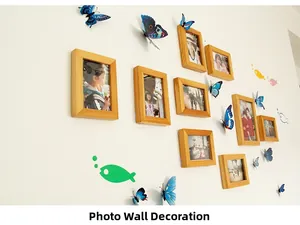 Detailed wall decor layout featuring blue 3D butterflies and natural wooden photo frames