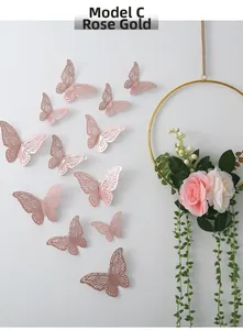 Detailed 3D hollow butterfly wall stickers in rose gold finish on a white wall
