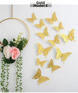 Detailed view of 3D gold hollow butterfly wall stickers styled in a flying pattern on wall