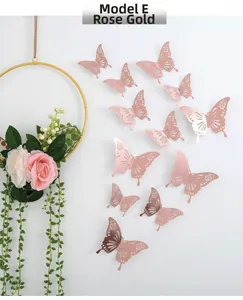 Detail of 3D hollow rose gold butterfly wall stickers with metallic texture for decor