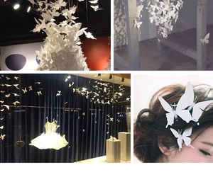 Detailed views of 3D white double-layer butterfly wall stickers and hair accessories