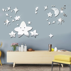 Detailed view of acrylic star and moon mirror wall stickers in a modern living room