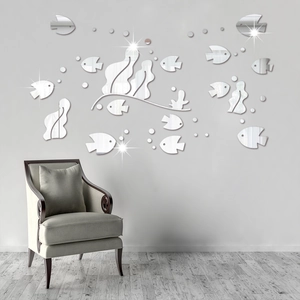 Macro detail of 3D acrylic mirror wall stickers featuring tropical fish in silver finish