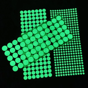 Luminous wall stickers with different sized glowing green dots for dark room decor