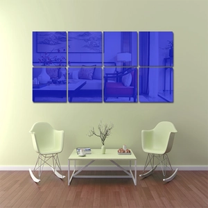Detailed view of eight square blue acrylic mirror wall decals in a modern living room