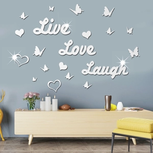 Detailed view of 3D acrylic mirror wall stickers with butterfly and heart motifs