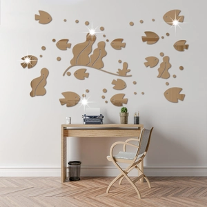 Detail of 3D acrylic mirror fish wall decals with golden reflection in a cozy home office