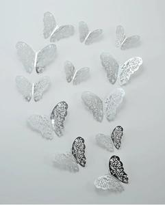 Set of 12 3D silver hollow butterfly wall stickers with intricate floral pattern