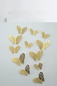Detailed laser-cut gold 3D butterfly wall stickers with intricate floral patterns