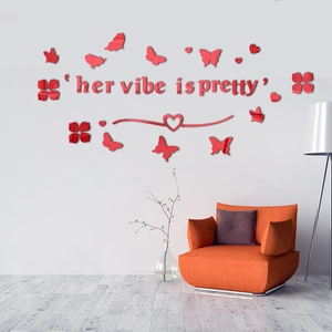 Detail showing 3D red acrylic butterfly mirror wall stickers with 'Her Vibe is Pretty' text