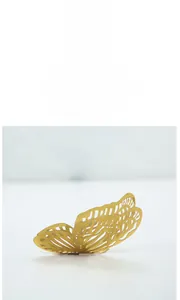 Detail of 3D golden butterfly wall sticker featuring elegant hollow carved textures