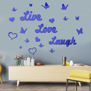 Detail of blue acrylic 3D wall stickers featuring Live Love Laugh text and butterflies