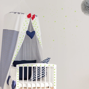 Luminous star wall stickers in nursery setting with glowing neon yellow finish