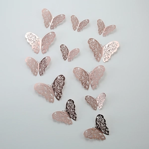 Set of 12 hollow 3D rose gold butterfly wall stickers with intricate floral filigree pattern
