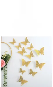 Set of 12 golden hollow 3D butterfly wall stickers with metallic texture for home decor