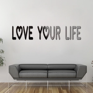 Macro detail of 3D acrylic mirror wall art featuring Love Your Life text on white wall