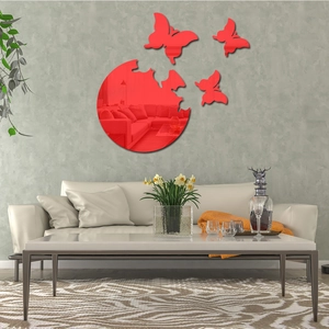 Detail of red acrylic 3D butterfly mirror wall stickers on a modern grey textured wall