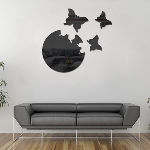 Acrylic mirror wall stickers with butterflies set displayed in a modern living room