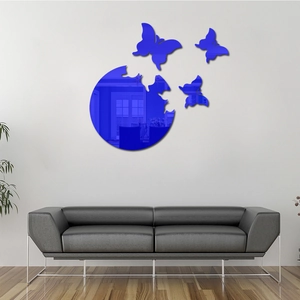 Detailed view of dark blue 3D butterfly mirror wall stickers on a modern living room wall