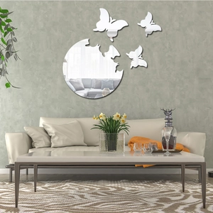 Detail of silver butterfly acrylic mirror wall stickers on a modern grey living room wall