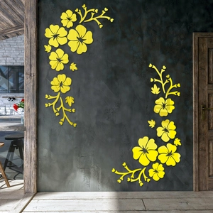 Detailed view of yellow hibiscus flower acrylic mirror wall decals on grey textured walls