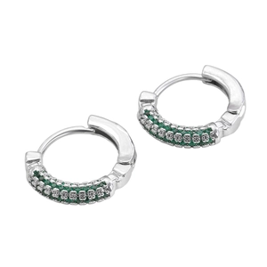 Detail of luxury hoop earrings with triple rows of green cubic zirconia in silver setting