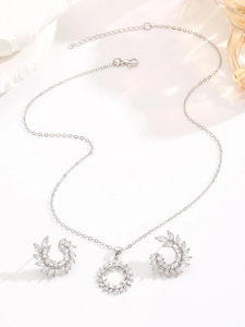 Detailed view of the zircon bridal jewelry set featuring olive leaf pendant and earrings