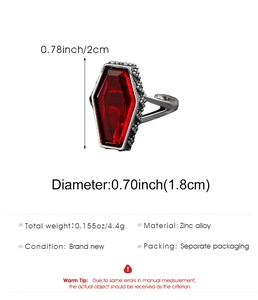 Close-up of gothic coffin ring with scarlet gemstone and adjustable zinc alloy band