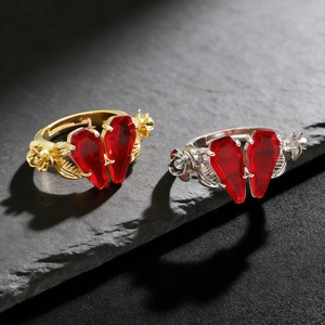 Gothic rings with scarlet coffin stones and rose vine details in gold and silver