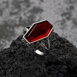 Macro shot of gothic coffin-shaped red gemstone ring with vintage silver detailing