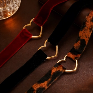 Three-piece choker set with burgundy velvet, black velvet, and leopard print heart rings