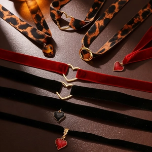 Short gothic chokers with heart charms and velvet leopard print bands set