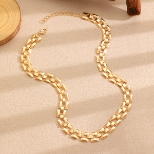 Macro shot of gold industrial style rectangle chain link necklace with lobster clasp