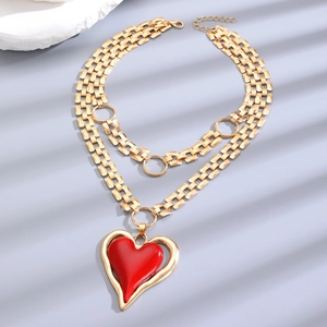 Vintage gold layered necklace featuring a bold hollow red heart resin pendant for women