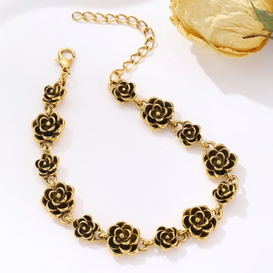 Close-up of vintage gold rose bracelet links with lobster clasp and adjustable chain
