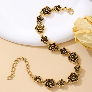 Close-up of vintage gold rose bracelet links with adjustable chain and lobster clasp