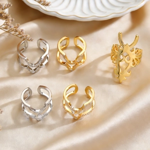 Minimalist copper rings with cubic zirconia inlay on elegant satin and ceramic tray