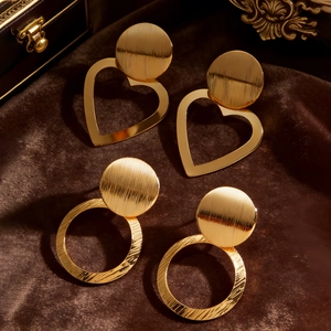 Elegant gold heart and circle hoop earrings set with brushed finish on velvet base