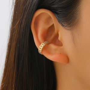 Chic gold-plated geometric link ear cuff for non-pierced ears on a female model