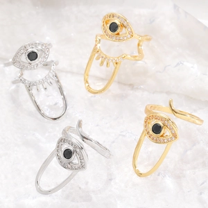 Detailed view of adjustable evil eye nail rings with sparkling zircon in gold and silver