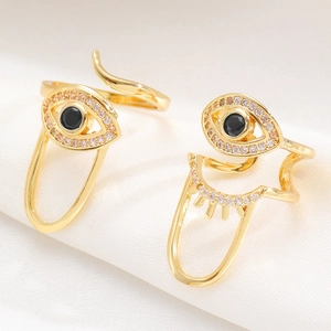 Adjustable gold evil eye rings set with black stone and white cubic zirconia accents
