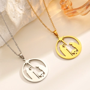 Detailed view of religious hollow round pendants in gold and silver showing nativity scene
