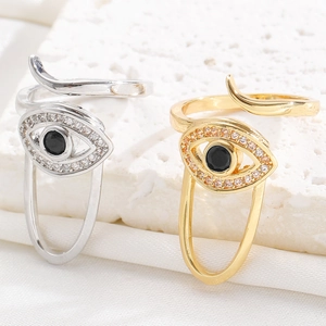 Detail of adjustable evil eye nail rings in gold and silver with zircon accents