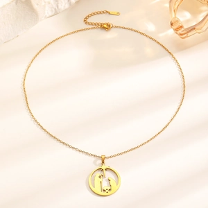 Golden stainless steel necklace featuring a religious Nativity scene open circle pendant
