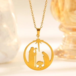Detailed close-up of golden hollow circular Jesus nativity pendant with O-chain